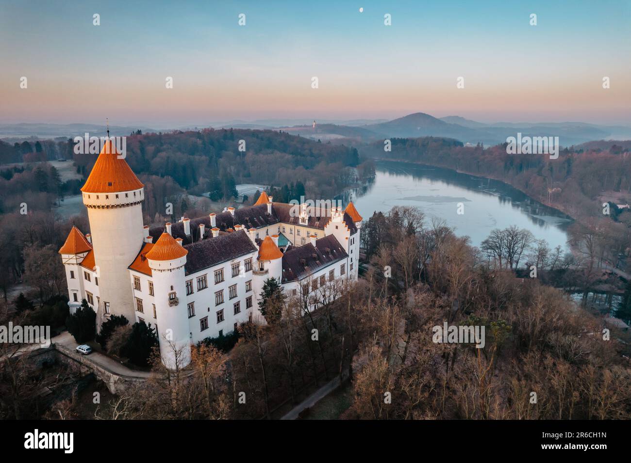 Aerial view of Konopiste,Czech fairytale castle.Picturesque autumn landscape at sunrise with impressive historical monument.Czech tourist attraction. Stock Photo