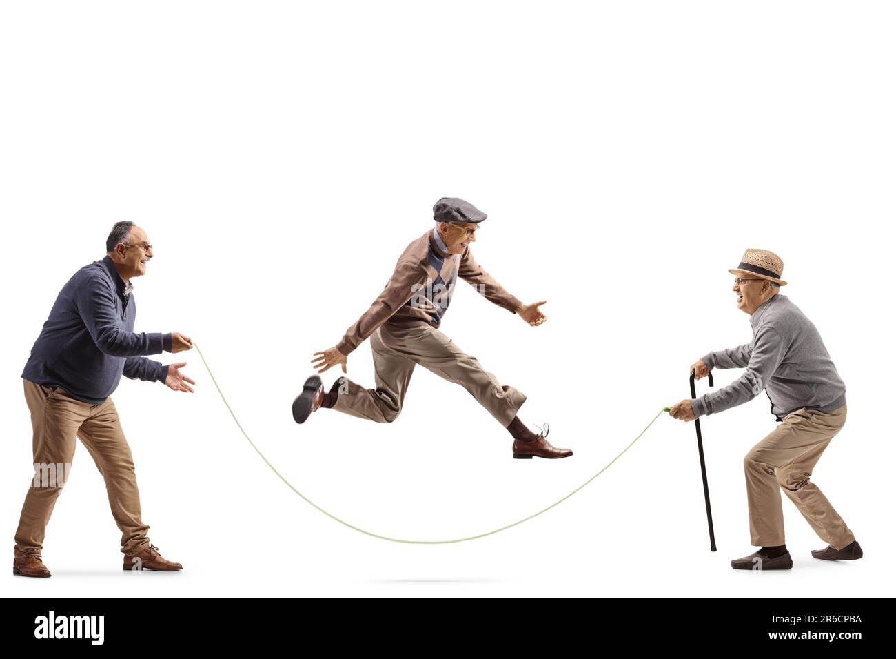 Elderly man playing a game with a skipping rope isolated on white ...