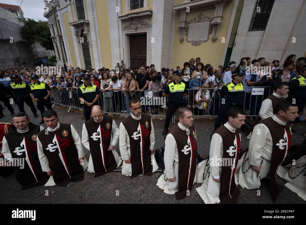 Catholic devotees wearing religious attire seen performing the liturgy