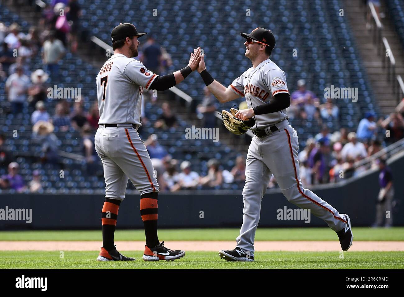 San Francisco Giants third baseman J.D. Davis, left, and center fielder