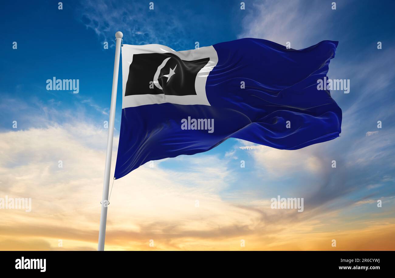official flag of Kemaman, Terengganu Malaysia at cloudy sky background on sunset, panoramic view. Malaysian travel and patriot concept. copy space for Stock Photo