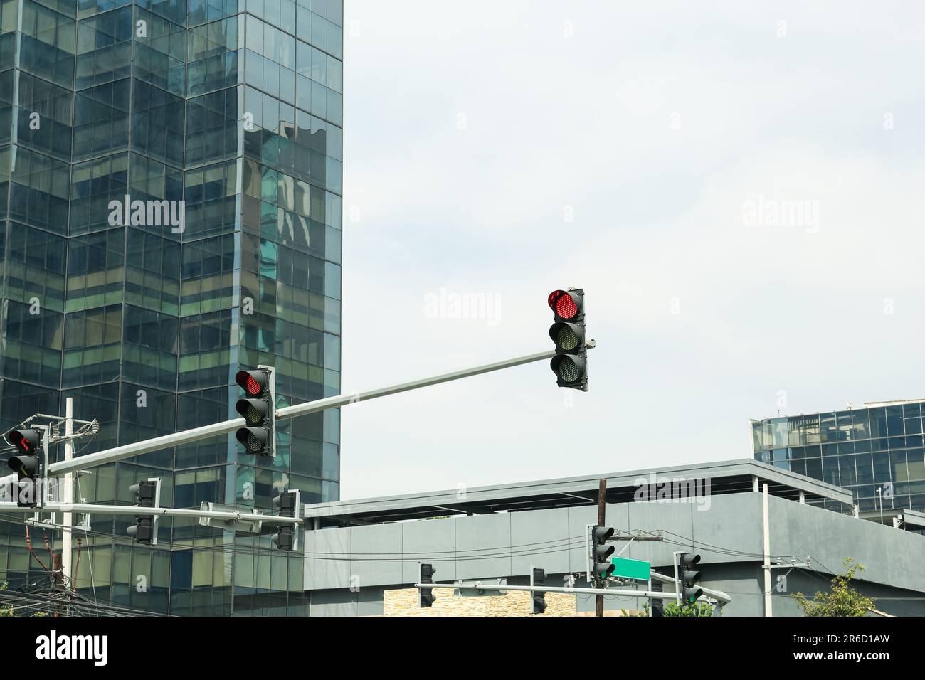 Overhead traffic lights in city. Road rules Stock Photo