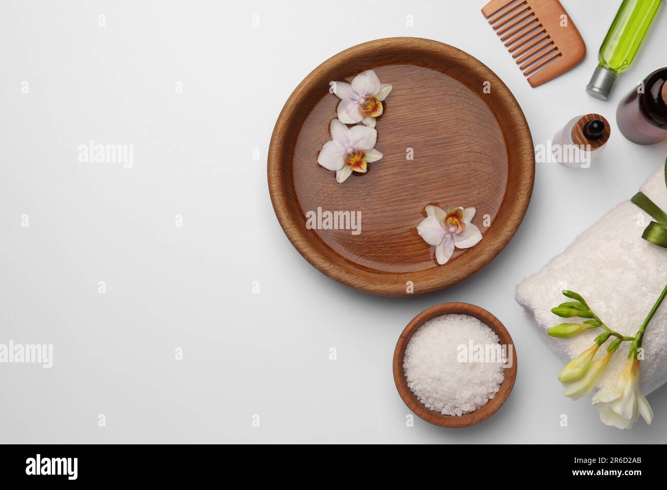 Flat lay composition with different spa products on white background ...