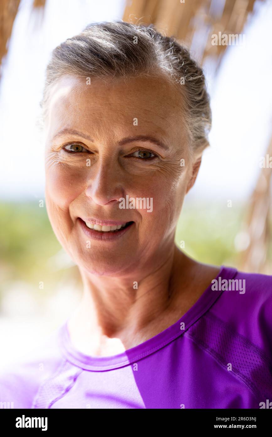 Close-up portrait of caucasian beautiful senior woman with brown eyes looking at camera Stock Photo