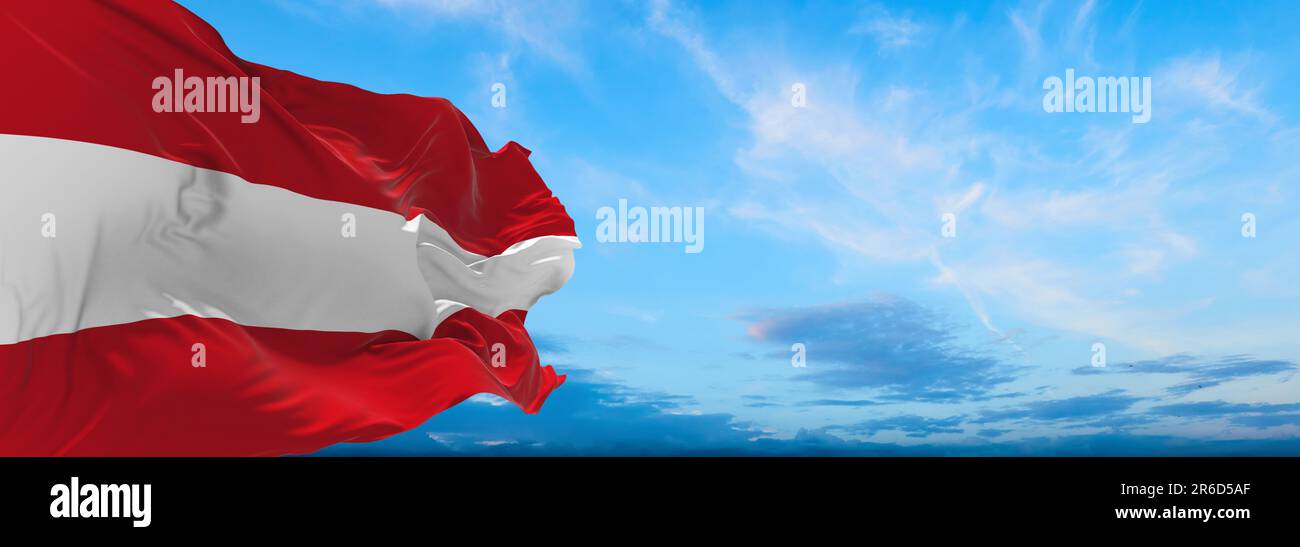 flag of German peoples Austrians at cloudy sky background, panoramic view. flag representing ethnic group or culture, regional authorities. copy space Stock Photo