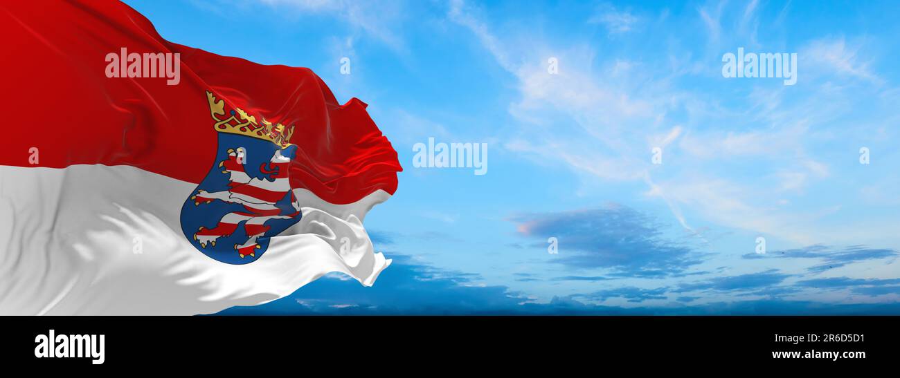 flag of German peoples Hessians at cloudy sky background, panoramic view. flag representing ethnic group or culture, regional authorities. copy space Stock Photo