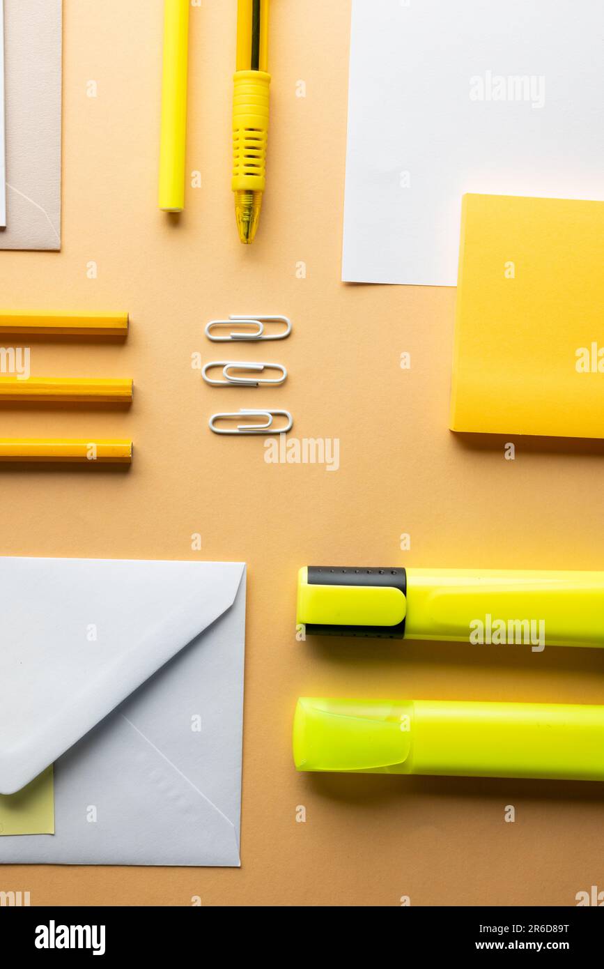 https://c8.alamy.com/comp/2R6D89T/flat-lay-of-yellow-pencils-pen-and-highlighter-and-white-paper-with-copy-space-on-yellow-background-school-materials-writing-colouring-drawing-l-2R6D89T.jpg