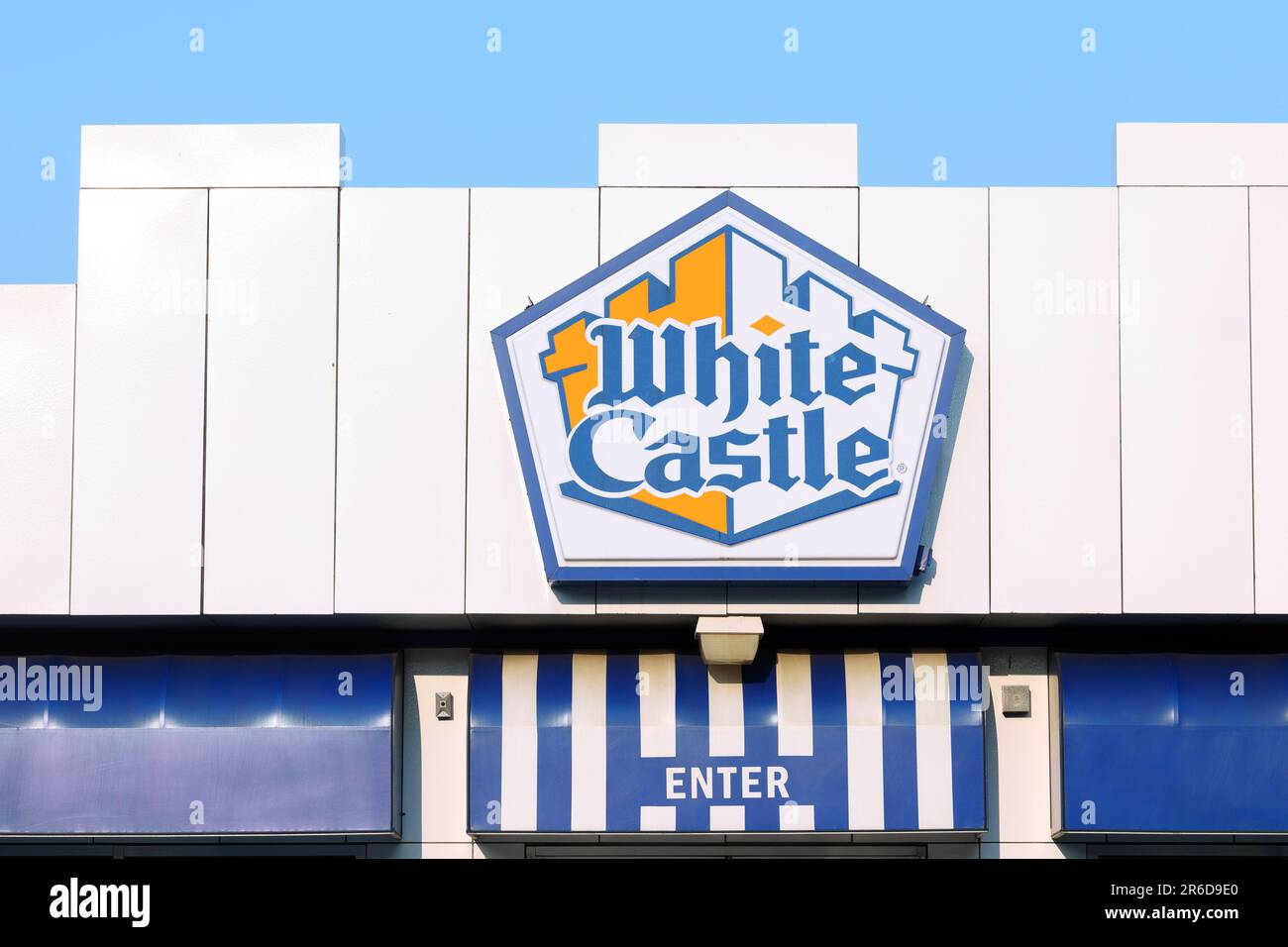 A White Castle fast food hamburger chain restaurant against a sunny blue sky. Stock Photo