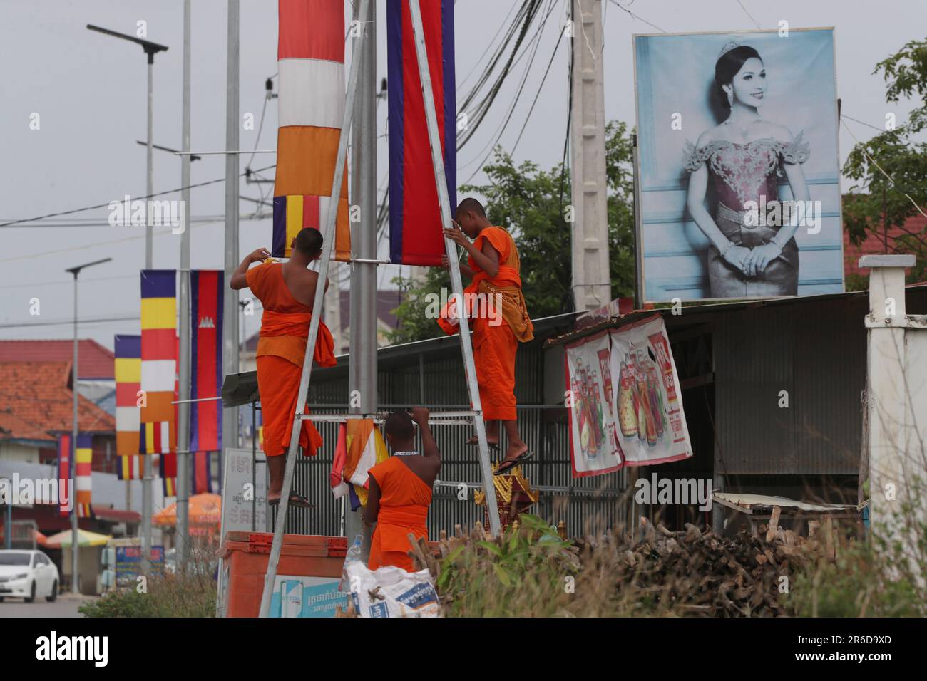 Cambodian Buddhist monks decorate Buddhist and their national flags as