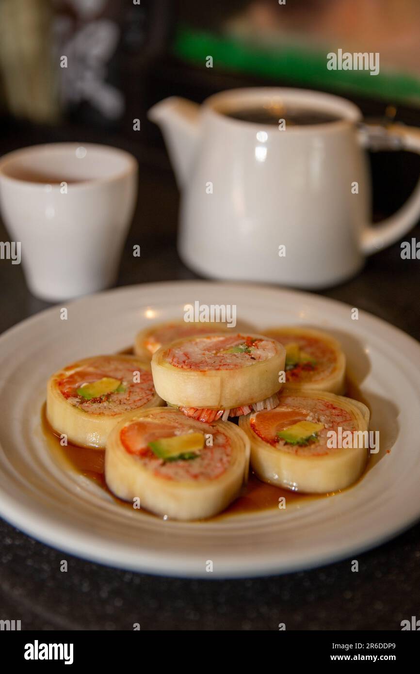 Naruto Maki Roll with Ponzu Sauce at a sushi bar Stock Photo