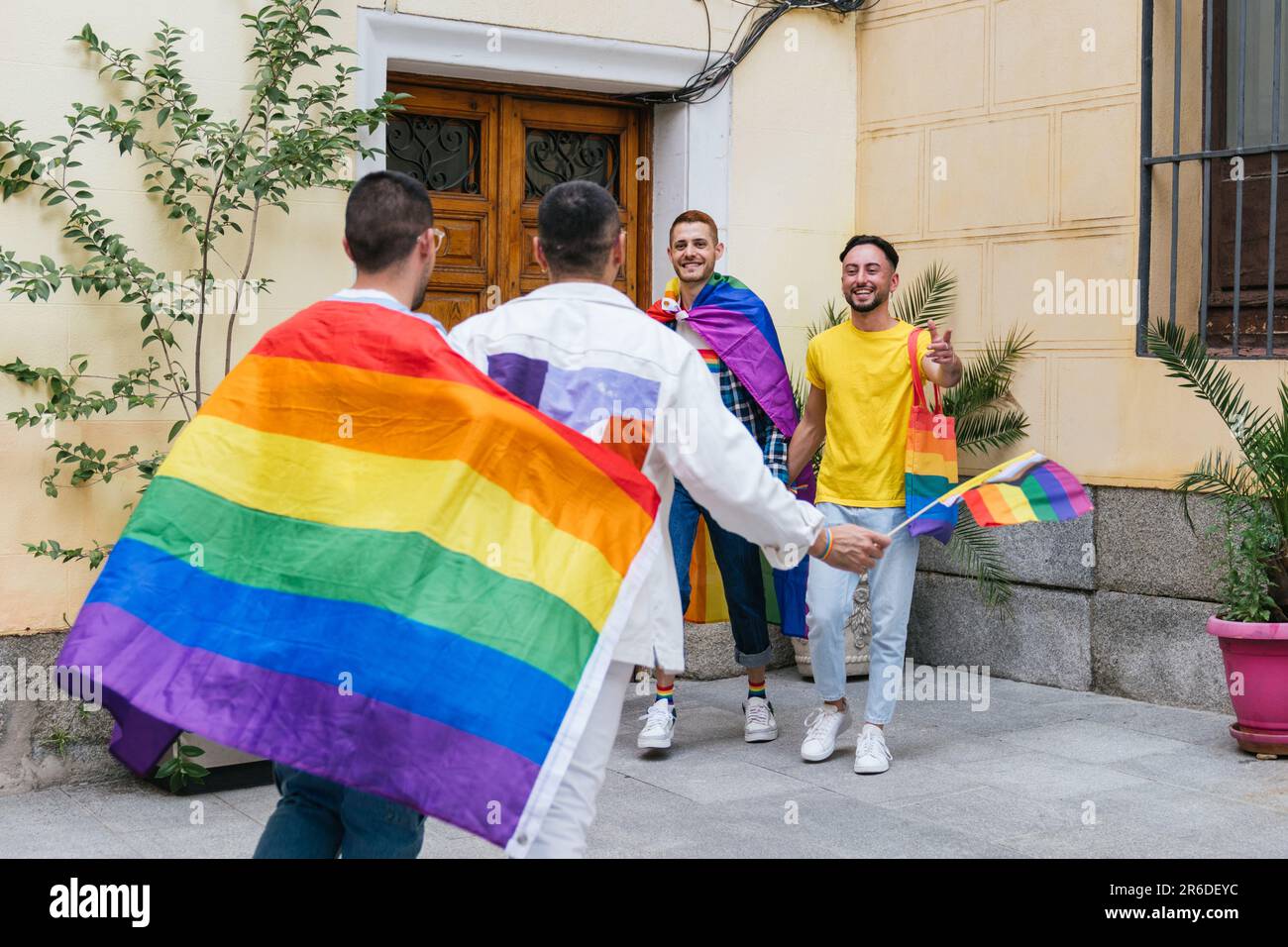 Joyful Gay Friends Welcoming with Pride: A Colorful Homecoming ...