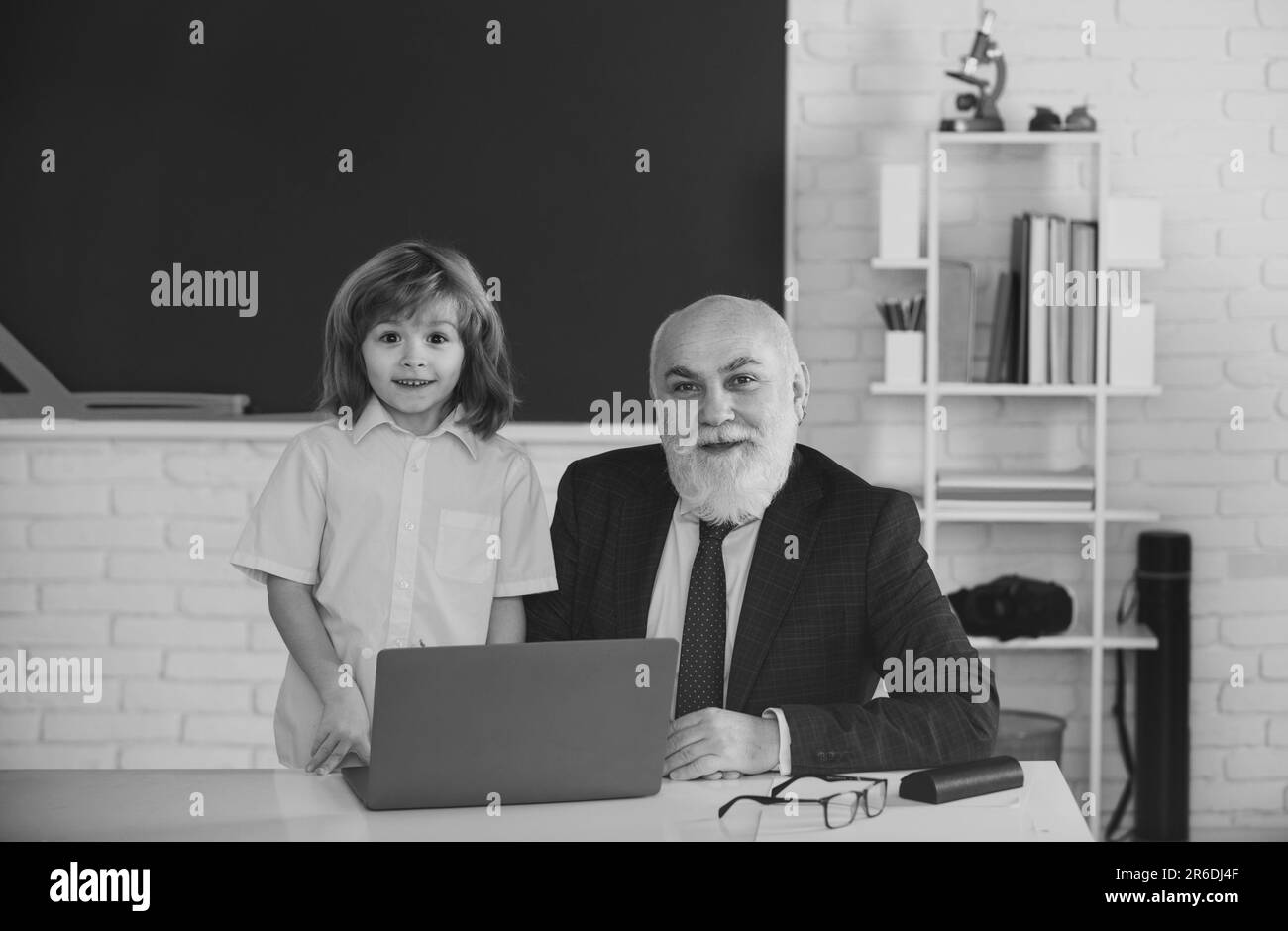 Teacher and child in classroom. Education concept. School learning concept. Boy elementary