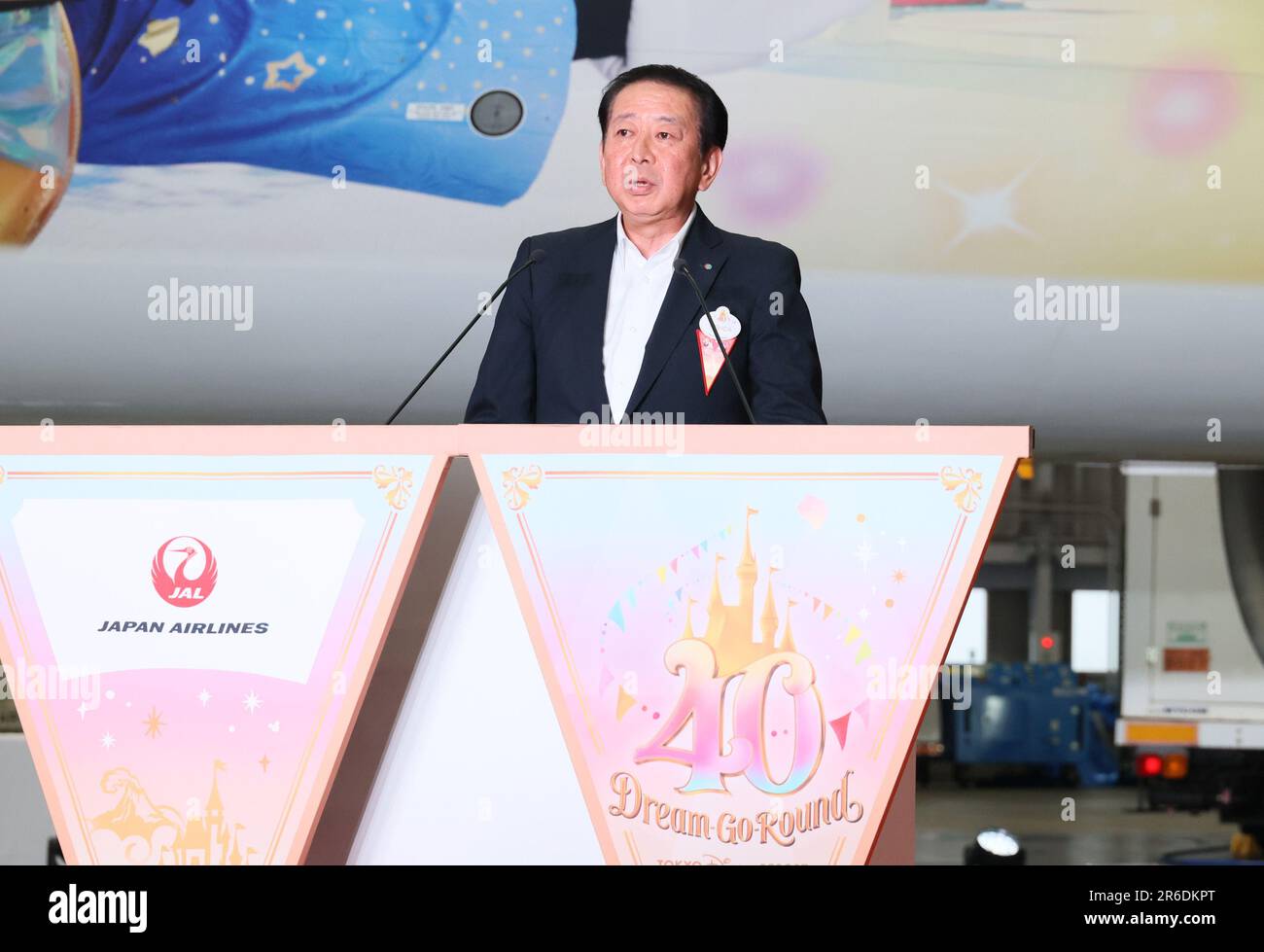 Tokyo, Japan. 9th June, 2023. Tokyo Disney Resort operator Oriental Land president Kenji Yoshida delivers a speech as Oriental Land and Japan Airlines (JAL) display the 'JAL Colorful Dreams Express' jetliner to celebrate the Disneyland's 40th anniversary at a JAL hangar at the Haneda airport in Tokyo on Friday, June 9, 2023. The new Disney characters designed Boeing 767 launched JAL's domestic routes. (photo by Yoshio Tsunoda/AFLO) Stock Photo