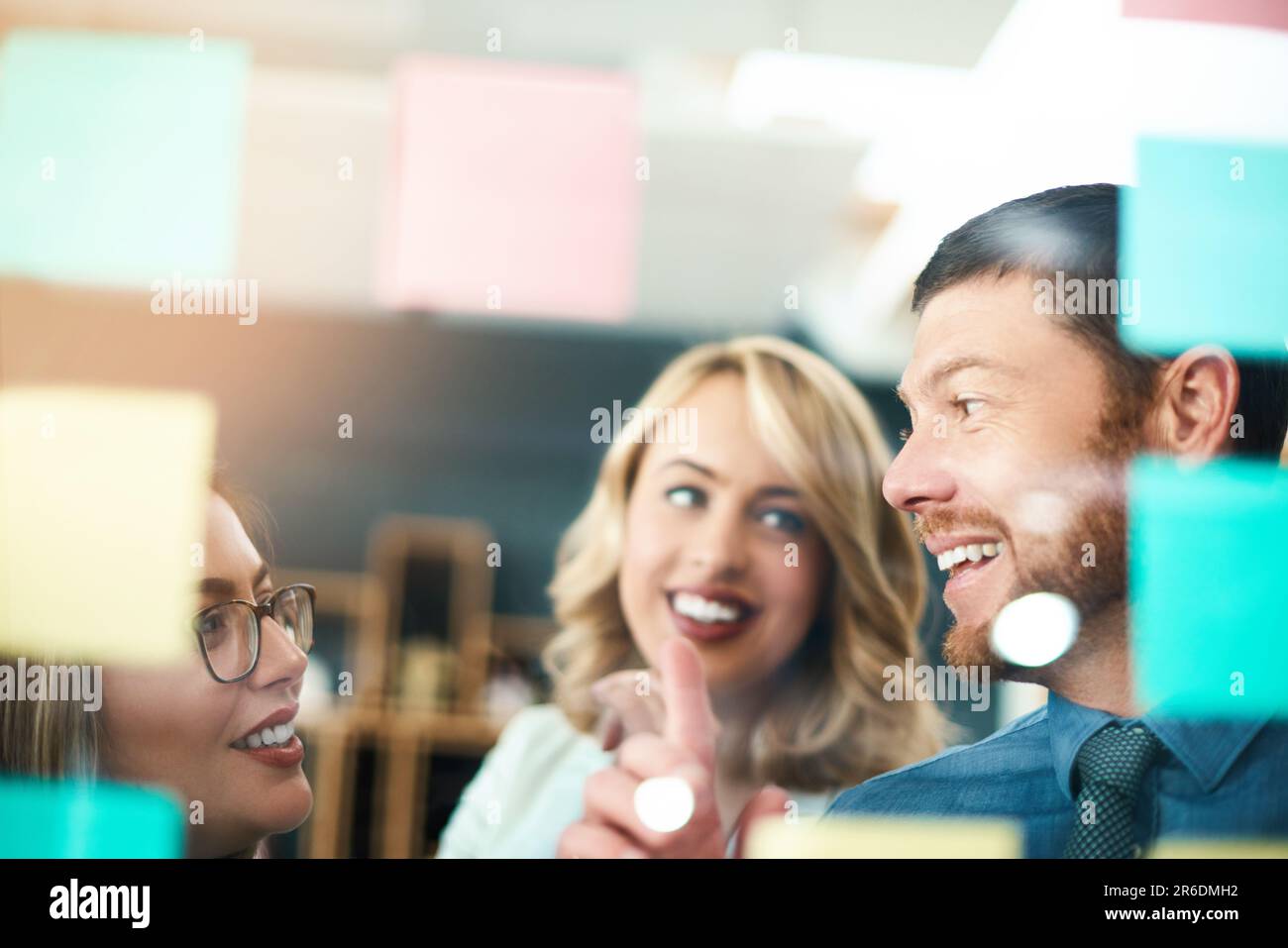 Happy business people, brainstorming and glass for agenda, feedback and