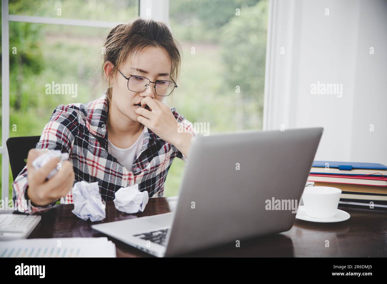 woman sitting down, his face unsettled. At the computer desk she has