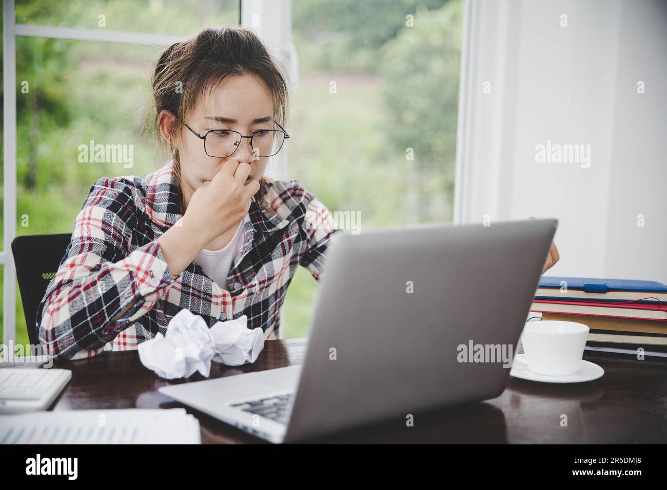 woman sitting down, his face unsettled. At the computer desk she has
