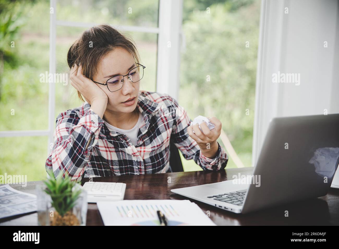 woman sitting down, his face unsettled. At the computer desk she has