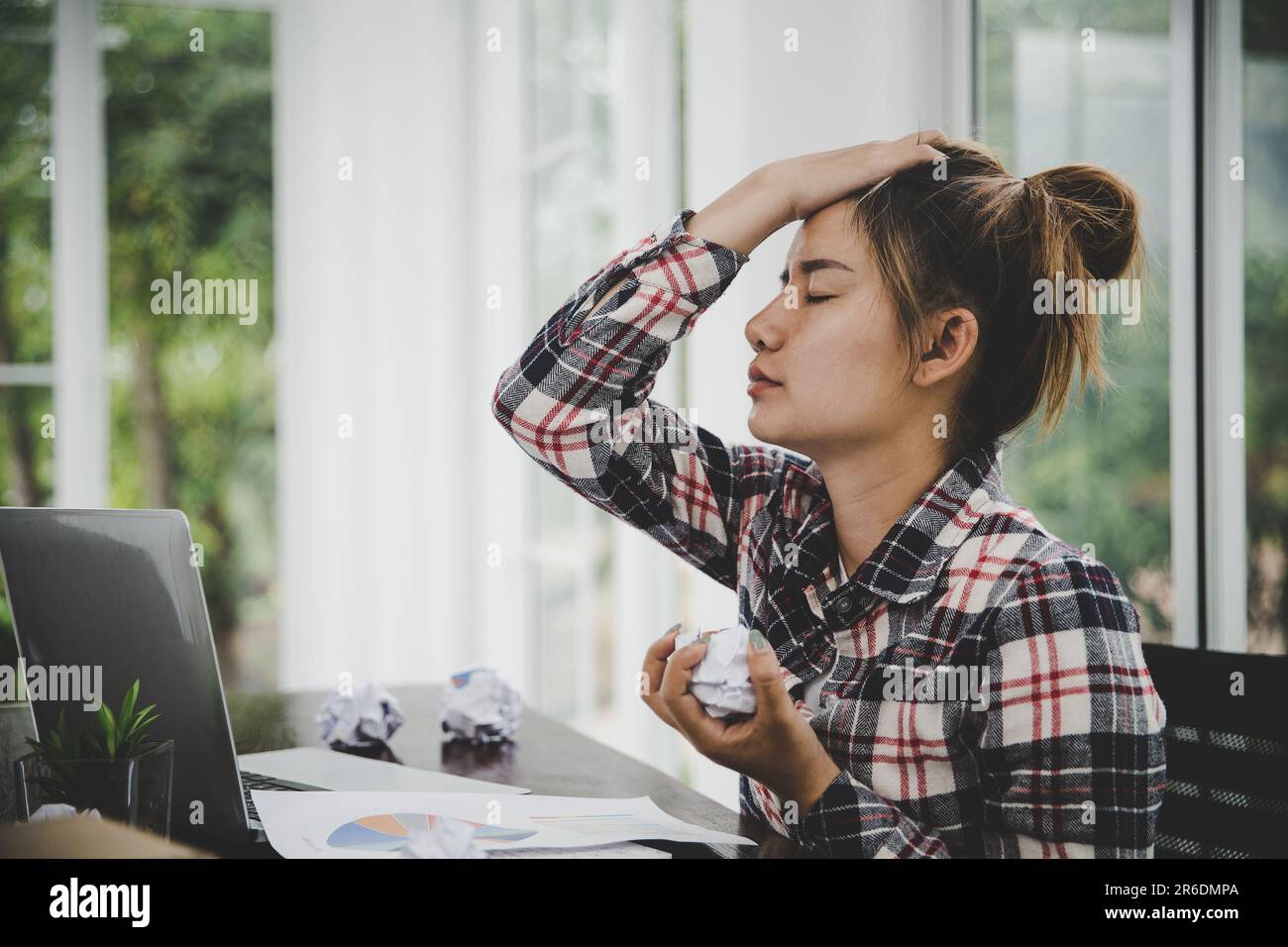 woman sitting down, his face unsettled. At the computer desk she has