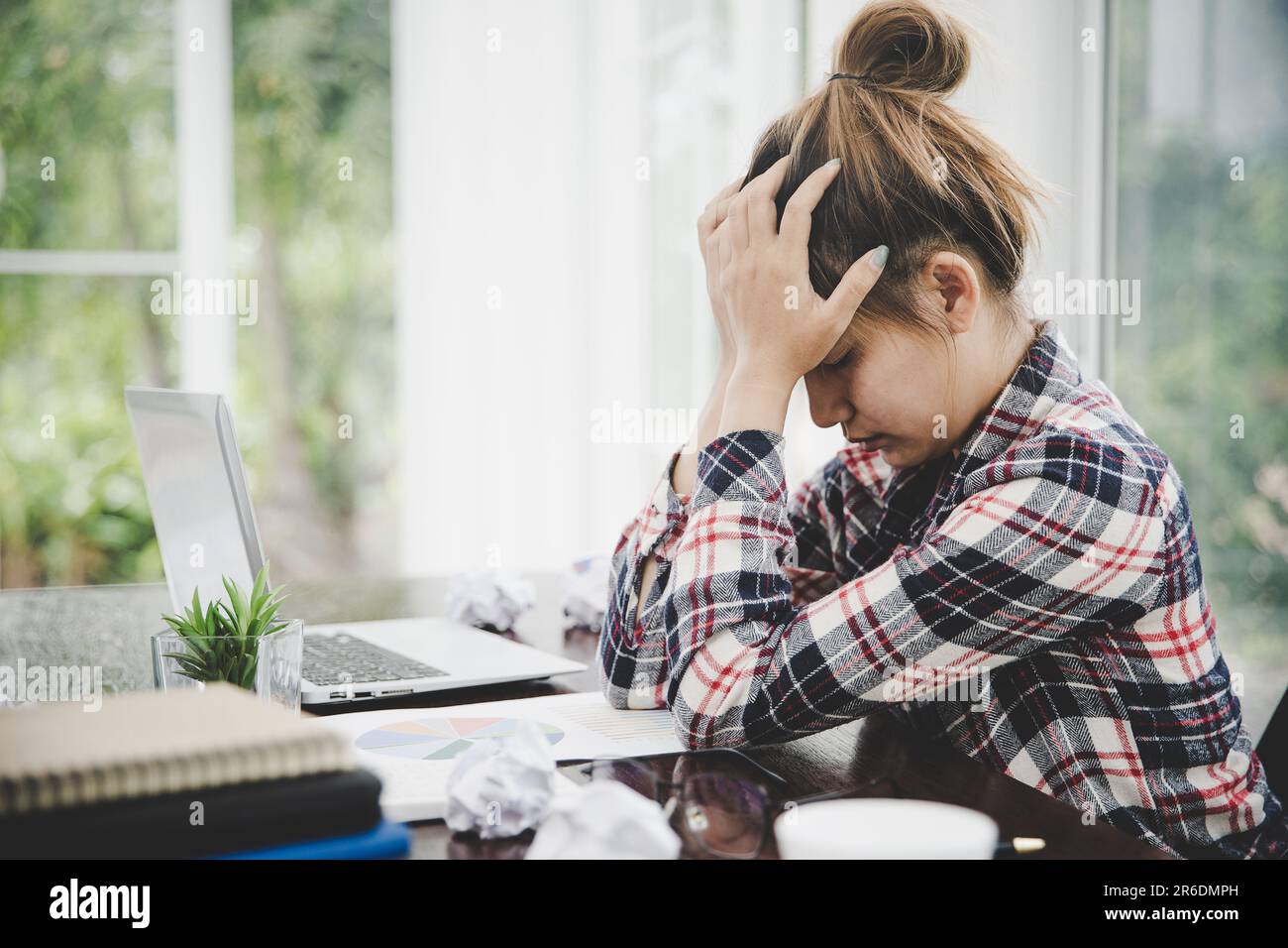 woman sitting down, his face unsettled. At the computer desk she has