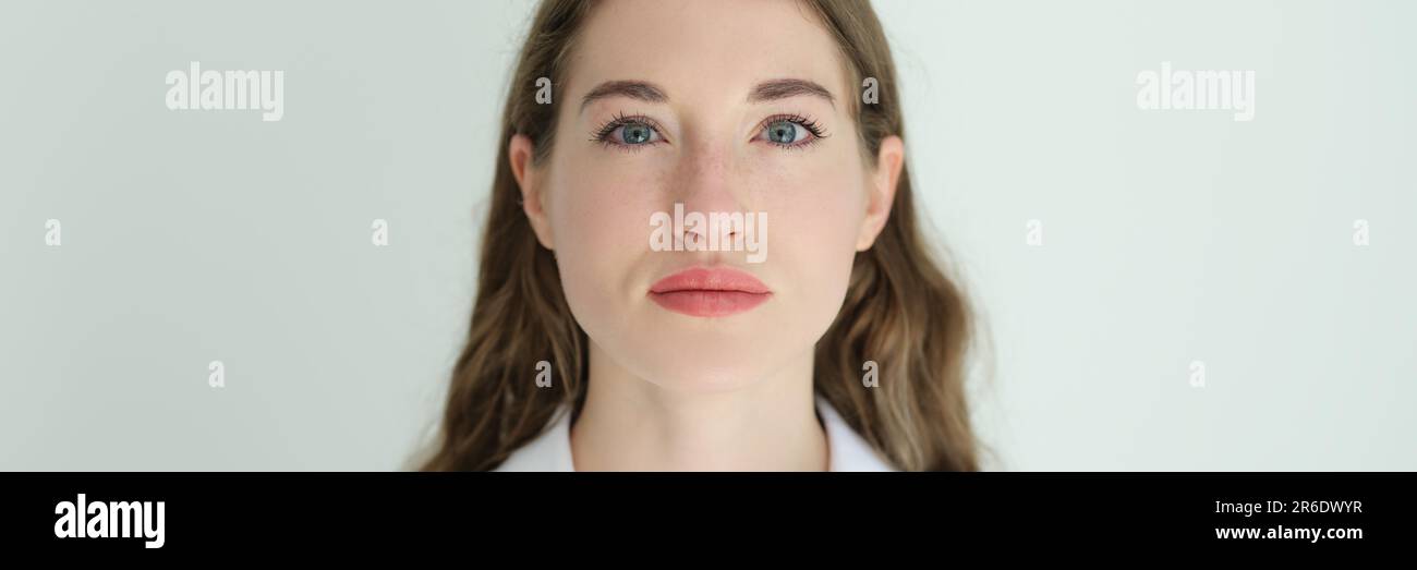 Portrait of young beautiful woman in white shirt Stock Photo - Alamy