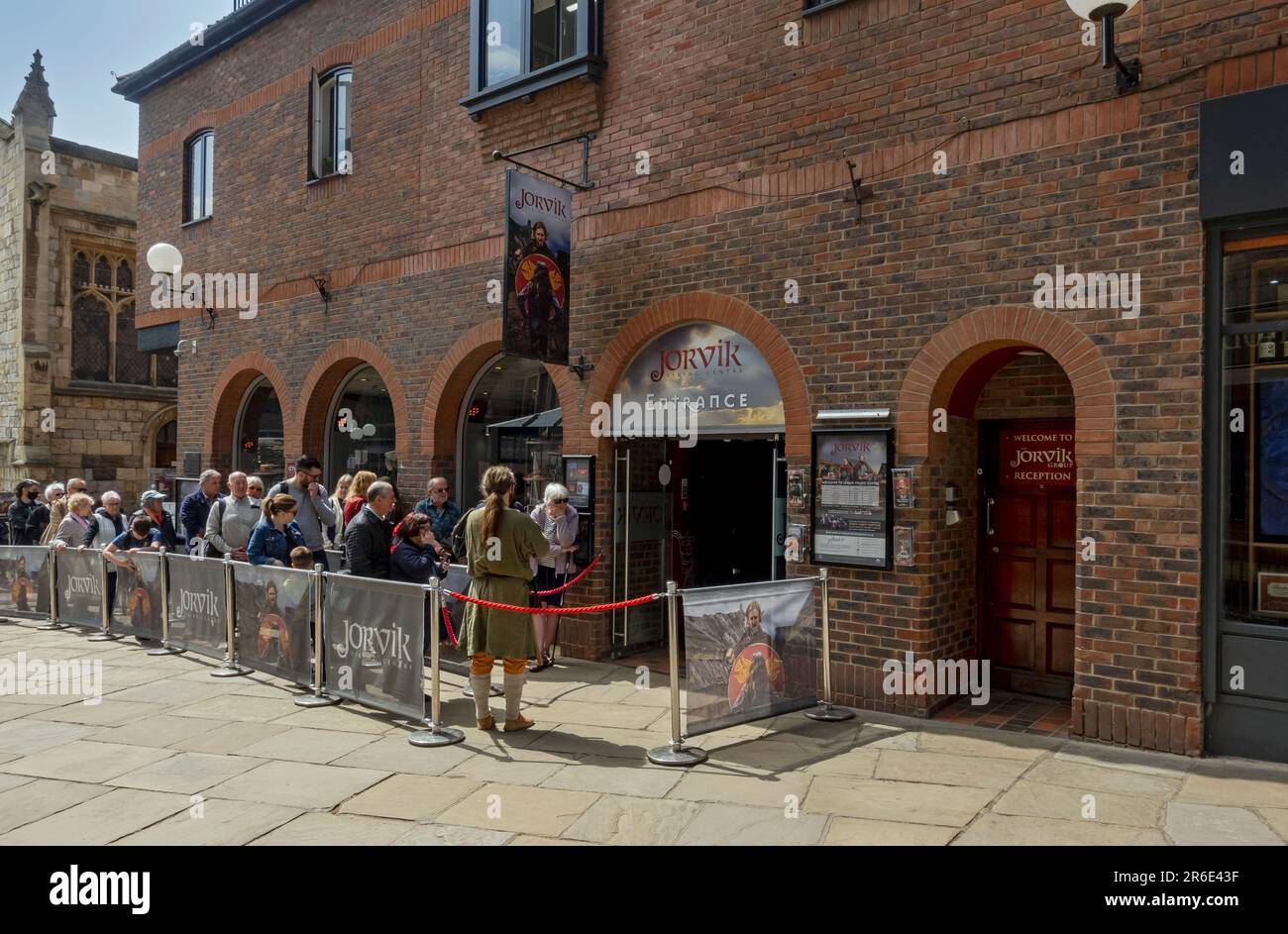 People queuing outside Jorvik Viking Centre museum attraction exhibition in summer Coppergate York North Yorkshire England UK United Kingdom Britain Stock Photo