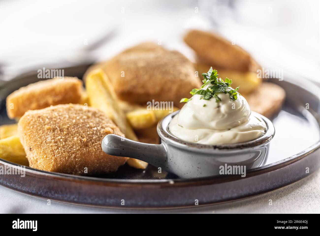 Fresh homemade mayonnaise as typical side of fried food such as chicken, cheese or chips. Stock Photo