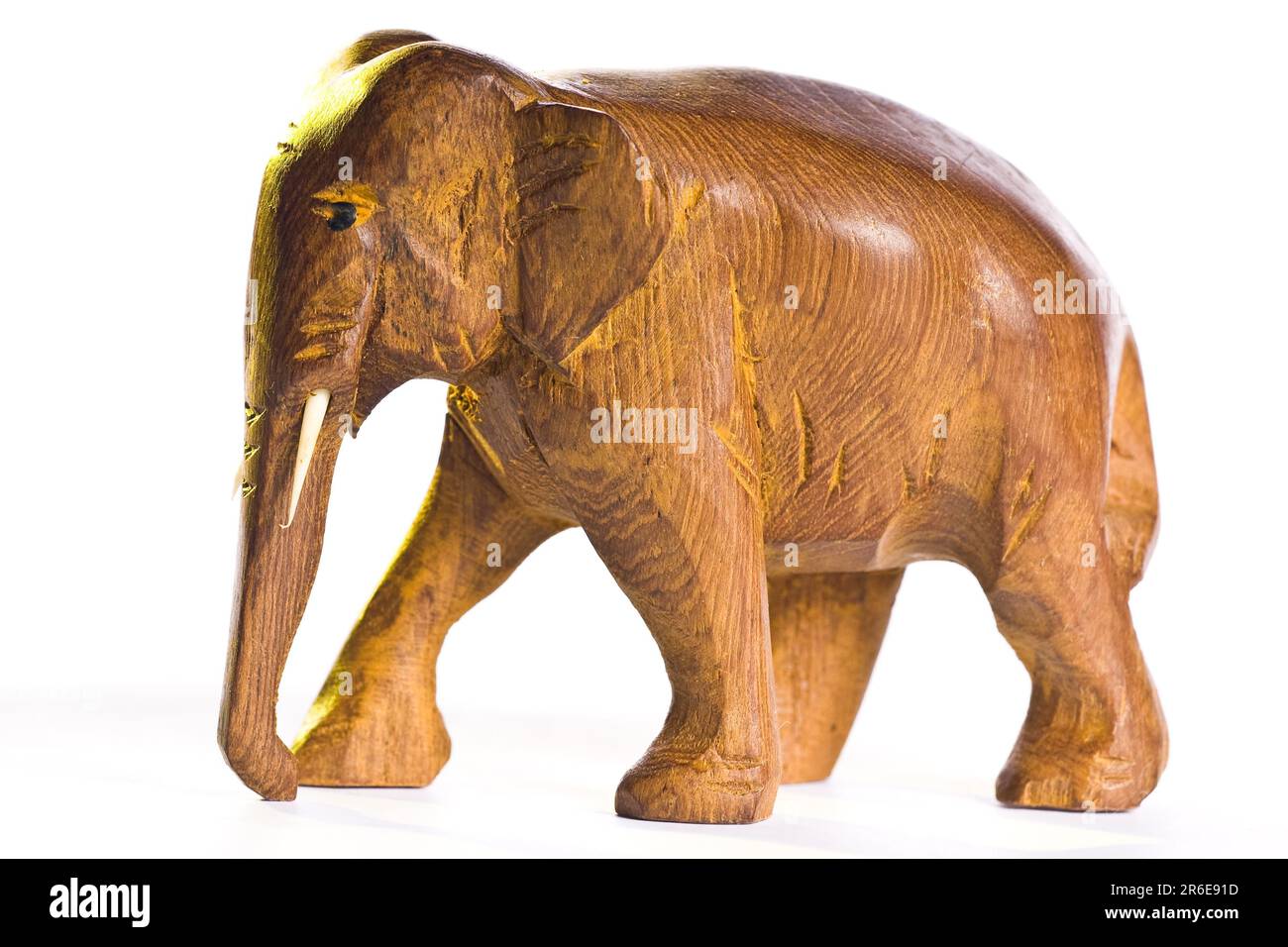 https://c8.alamy.com/comp/2R6E91D/small-elephant-wood-sculpture-on-white-background-2R6E91D.jpg