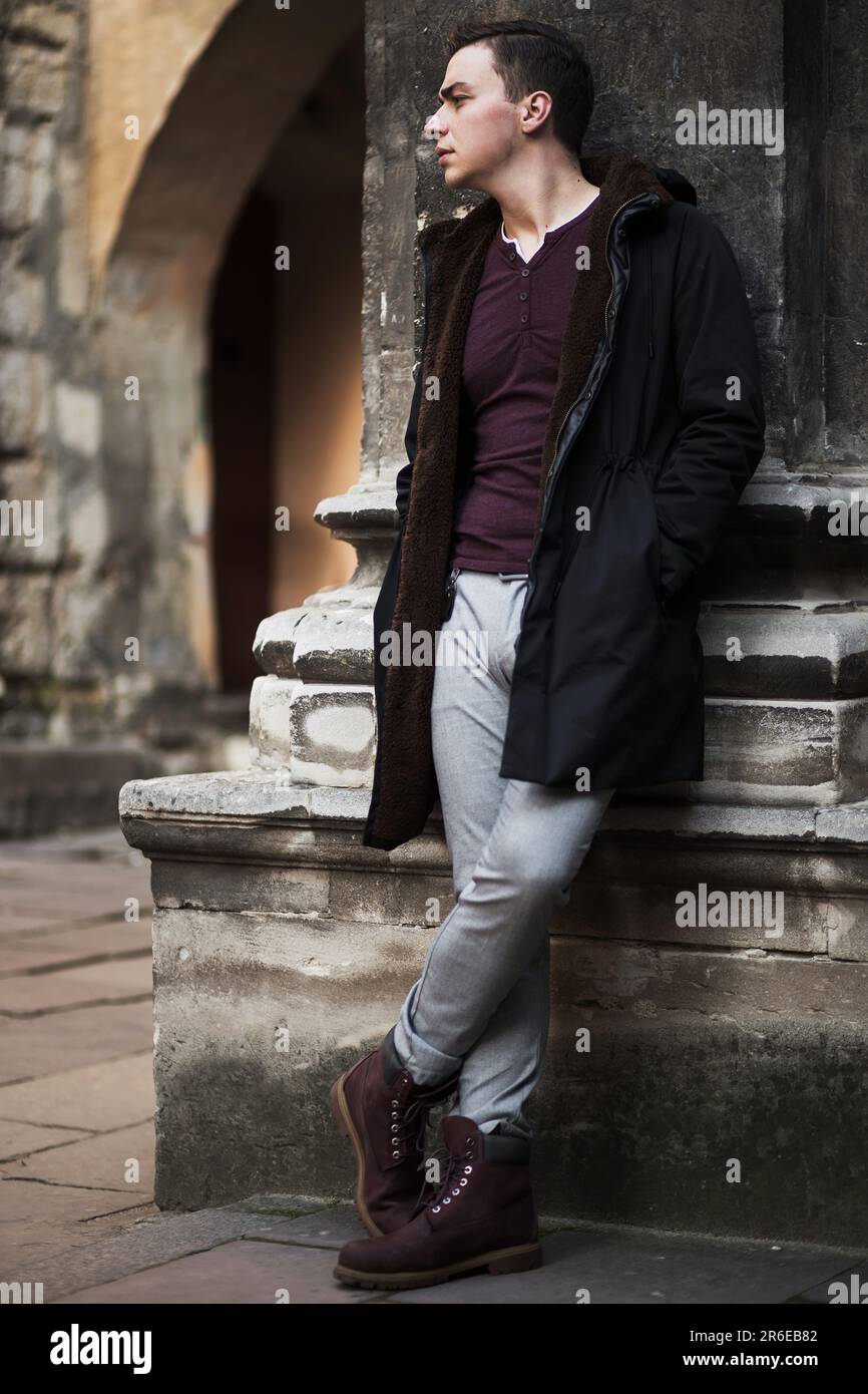 young stylish man on the street of a European city in autumn Stock Photo