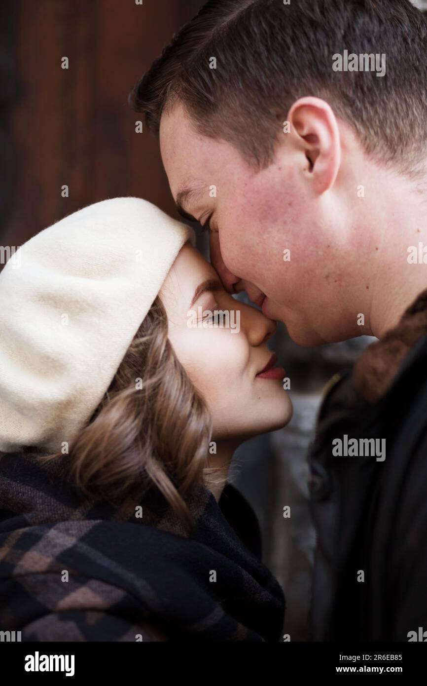 Old woman and young man kissing hi-res stock photography and images - Alamy
