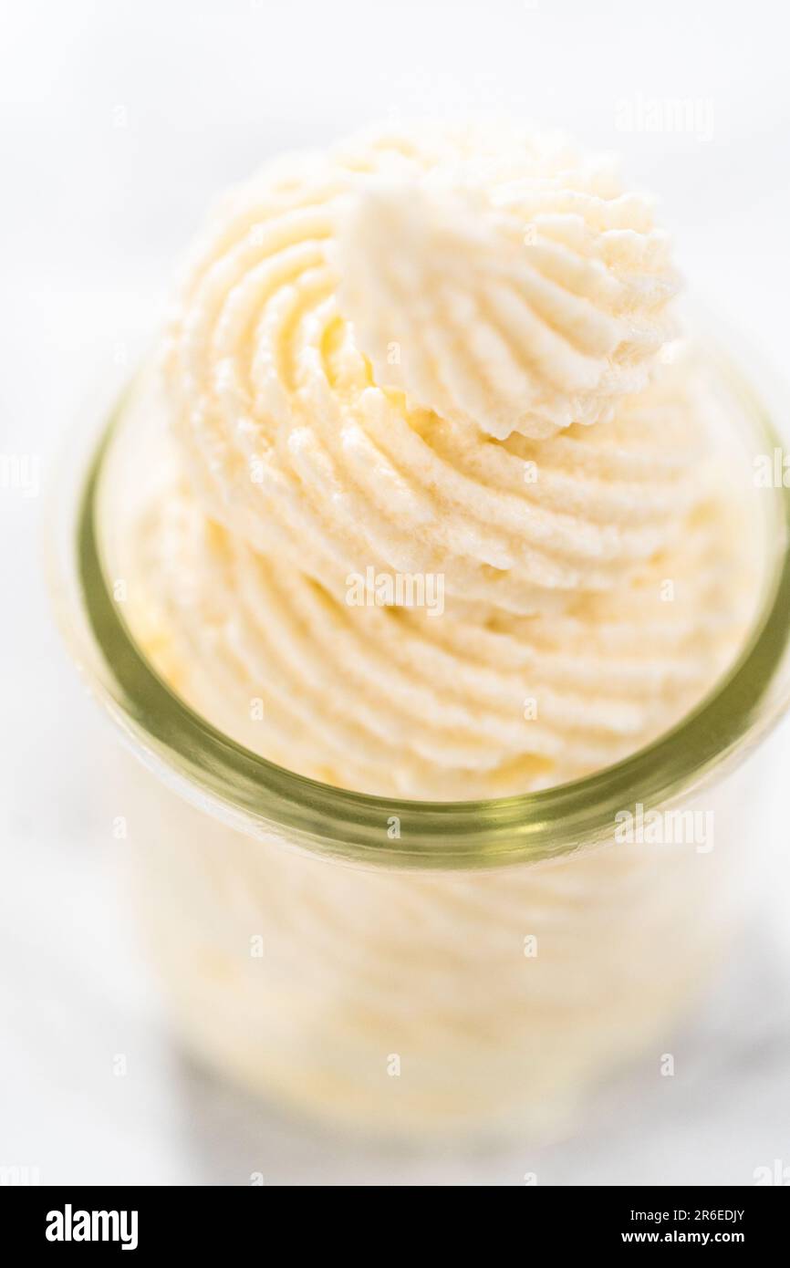 White chocolate ganache frosting Stock Photo Alamy