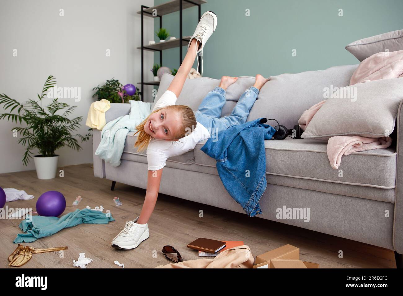 The child scattered things in the room Stock Photo - Alamy