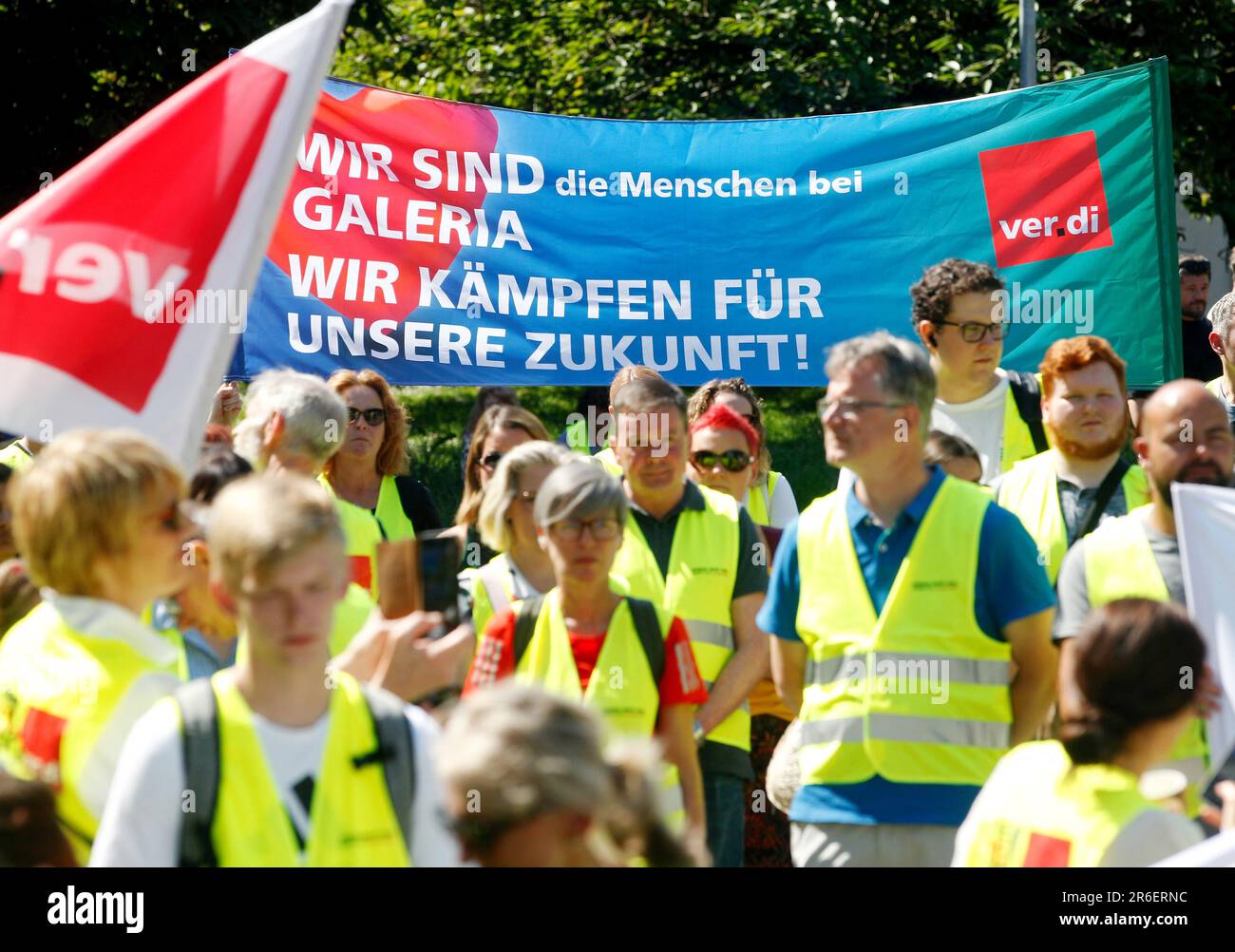 Essen, Germany. 09th June, 2023. Employees of Galeria Karstadt Kaufhof demonstrate with a poster 'We are the people at Galeria - We fight for our future'. Employees of the department stores in Duisburg (Tonhallenstr. and Düsseldorfer Str.), Wuppertal, Dortmund, Münster (Salzstr. and Ludgeristr.), Cologne (Breite Str. and Hohe Str.), Siegburg, Aachen, Bochum, Oberhausen, Mülheim a. d. Ruhr and Essen are called to strike. Credit: Roland Weihrauch/dpa/Alamy Live News Stock Photo