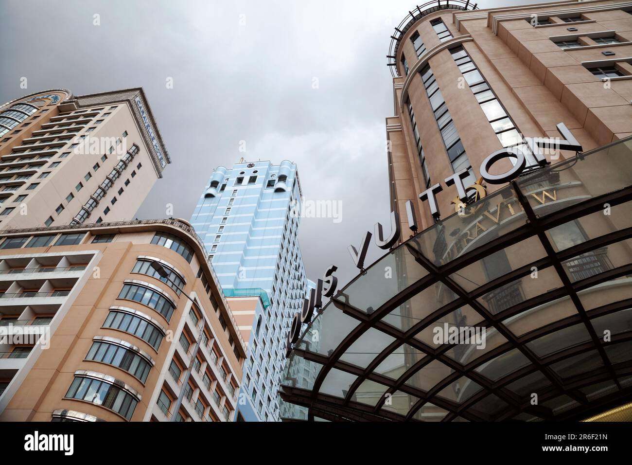 Ho Chi Minh City, Vietnam - June 4, 2023: Fashion store commercial sign with Luis Vuitton logo against a beautiful cityscape. Popular luxury clothing - Stock Image