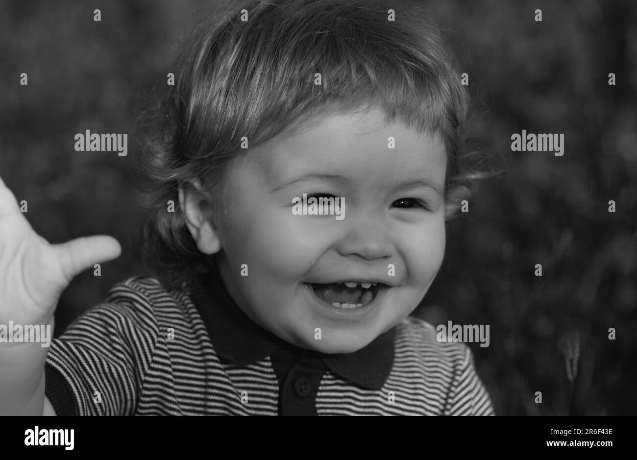 Portrait Of Cute Excited Boy Having Fun In Garden. Baby Face Close Up 