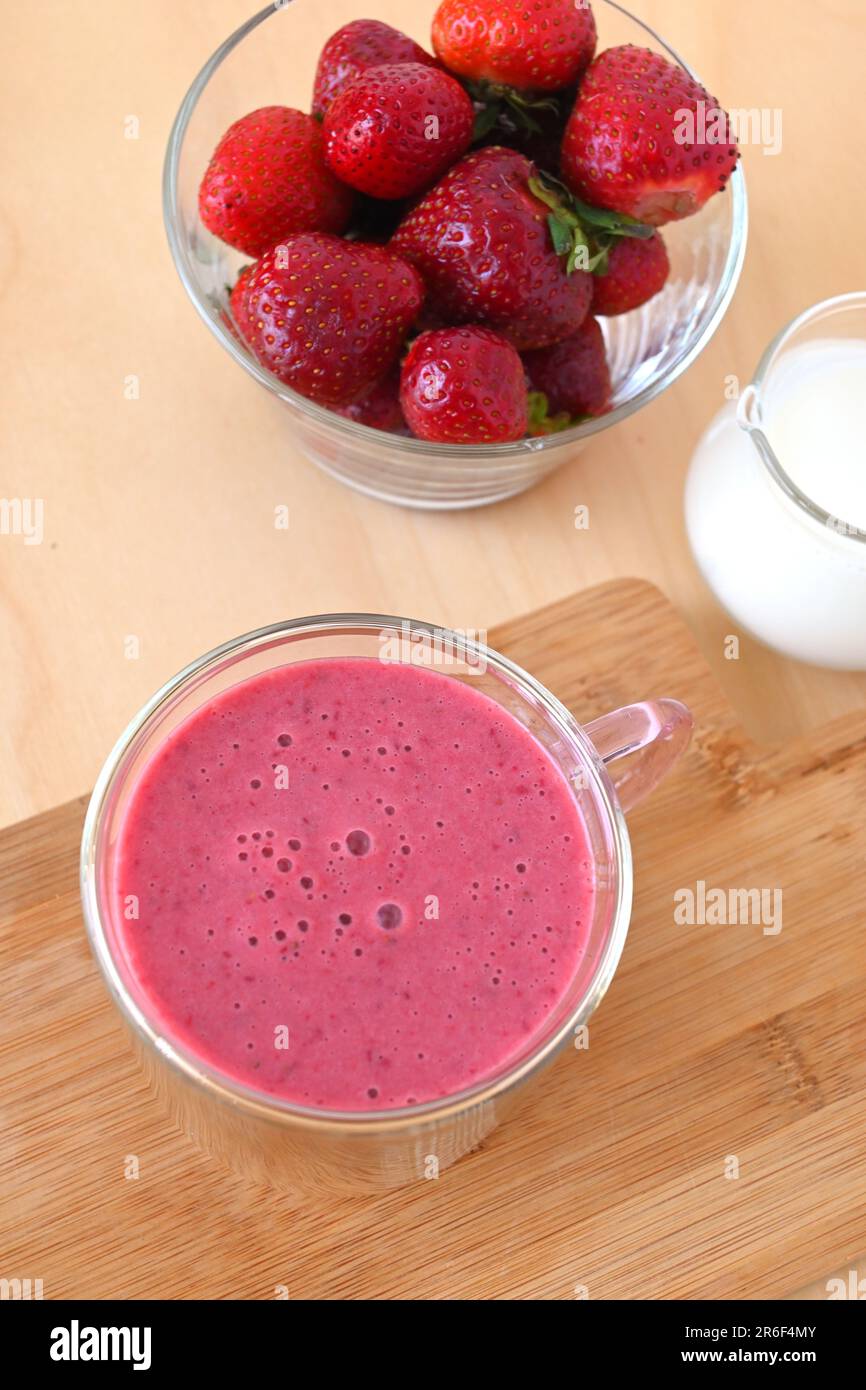 Fresh strawberry fruit smoothie with cold milk Stock Photo
