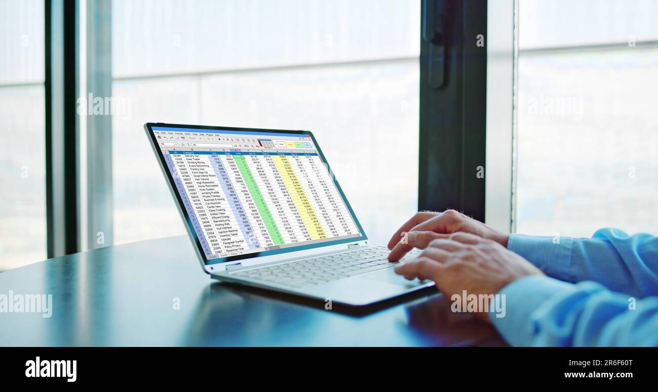 Spreadsheet Data Analyst Using Computer Software On Laptop Stock Photo