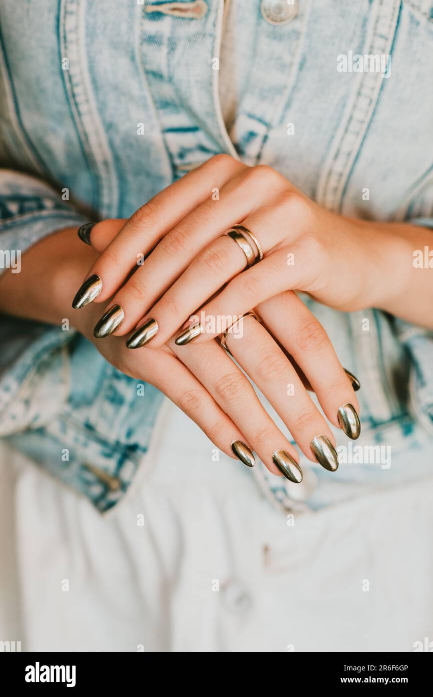 Stylish trendy female mirror manicure, metal nail art Stock Photo