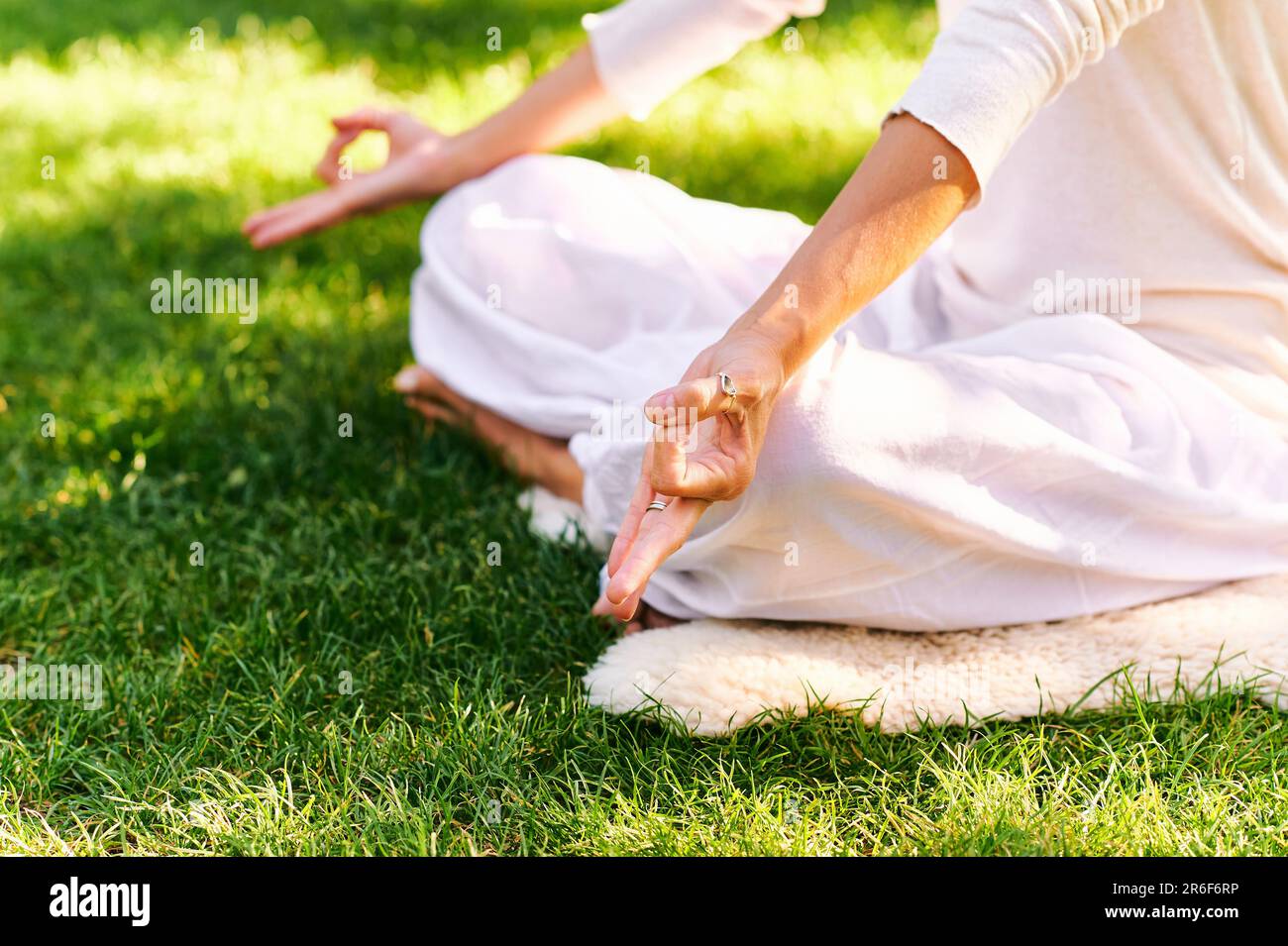 Beautiful Mature Woman Meditating In Green Sunny Garden, Healthy ...