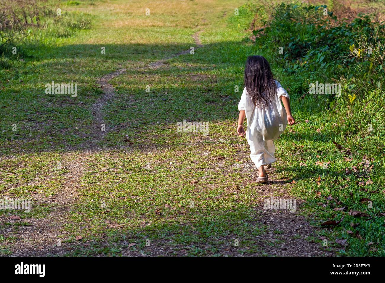 Mexican indigenous Lacandon Mayan girl in traditional white dress, Chiapas rainforest, Mexico. Stock Photo