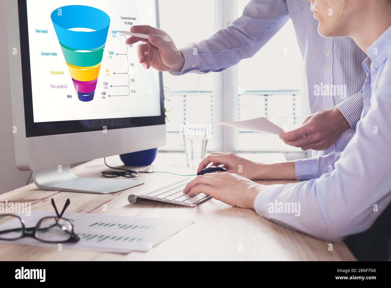 Marketing funnel and data analytics used by a team of sales consultant to analyze leads generation, conversion rate, and sales performance of e-commer Stock Photo