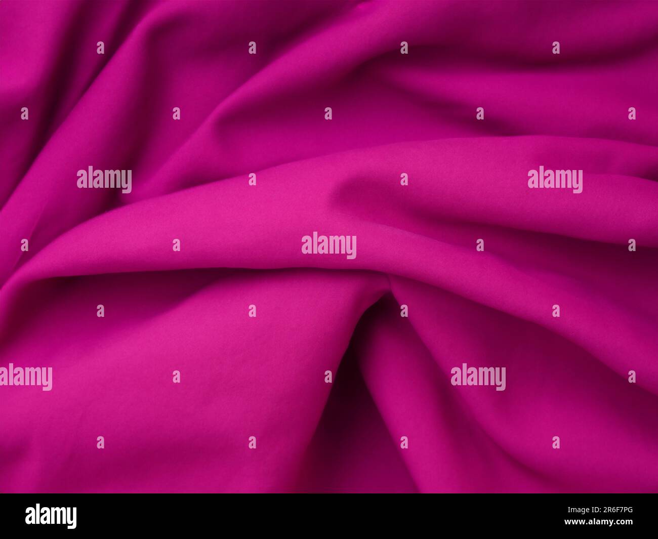 a close up of a pink fabric with a very soft feel. . Stock Photo