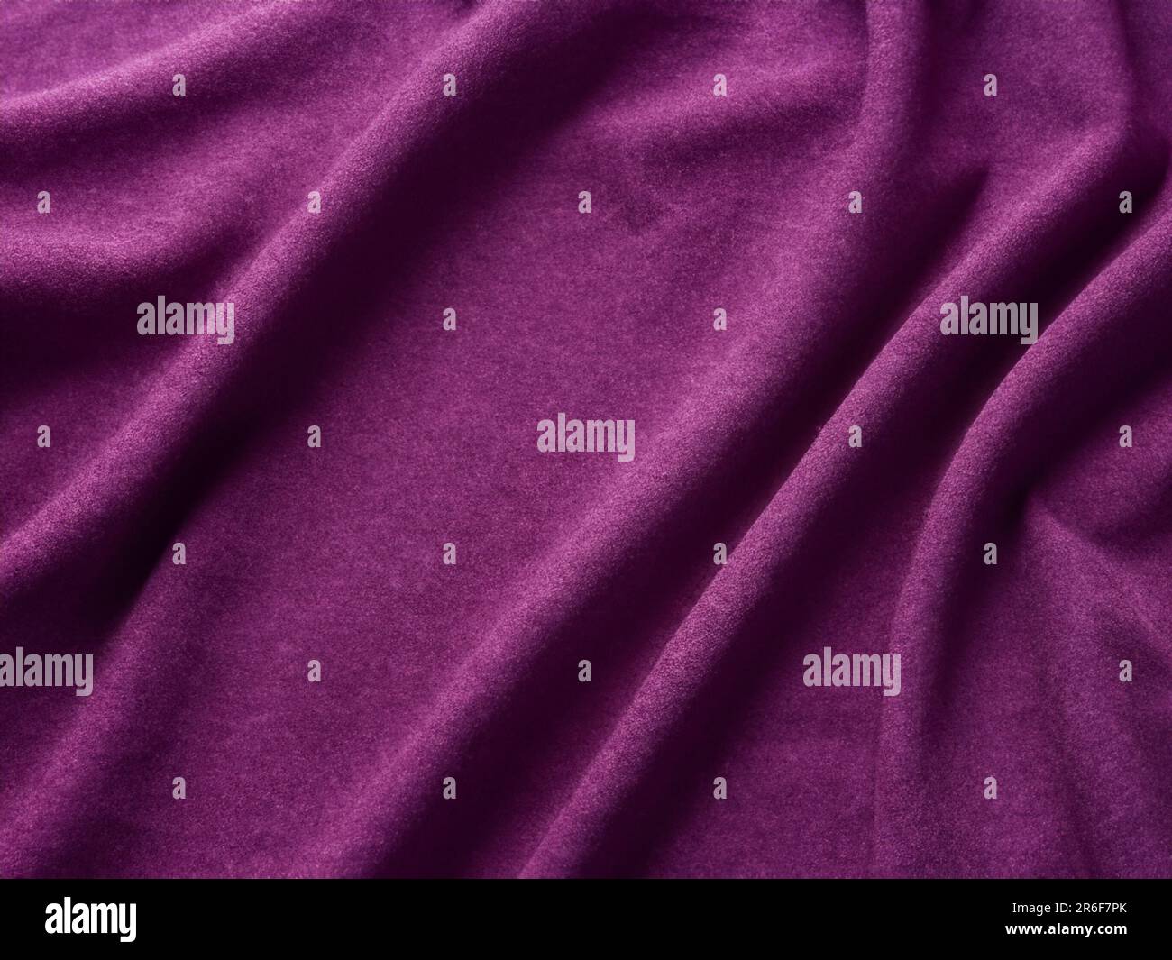 a close up of a purple cloth textured with a thin line. . Stock Photo