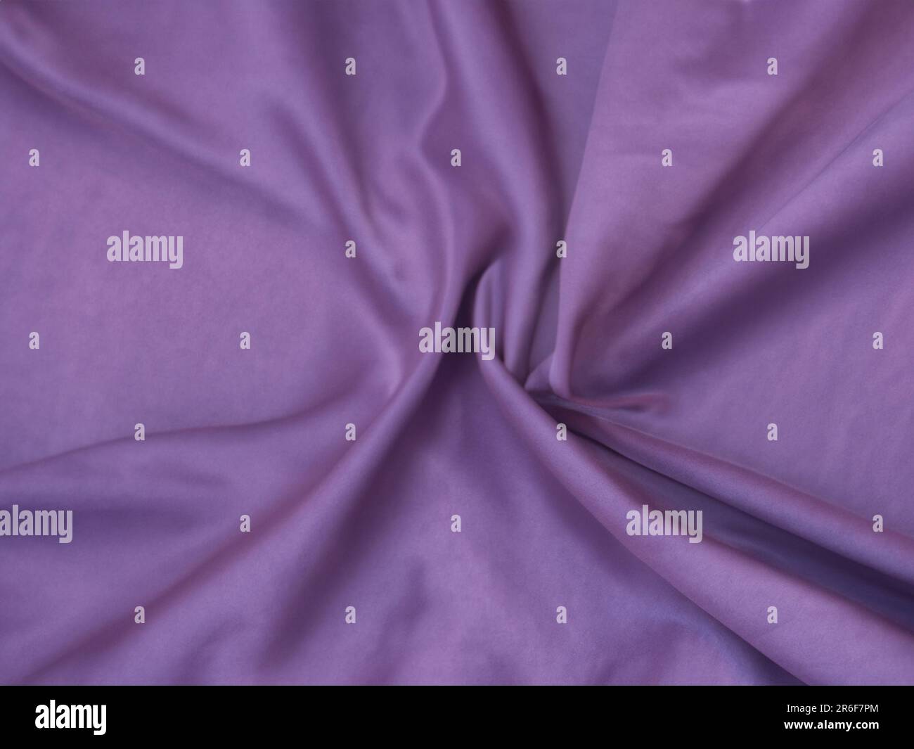 a close up of a purple fabric with a white background. . Stock Photo