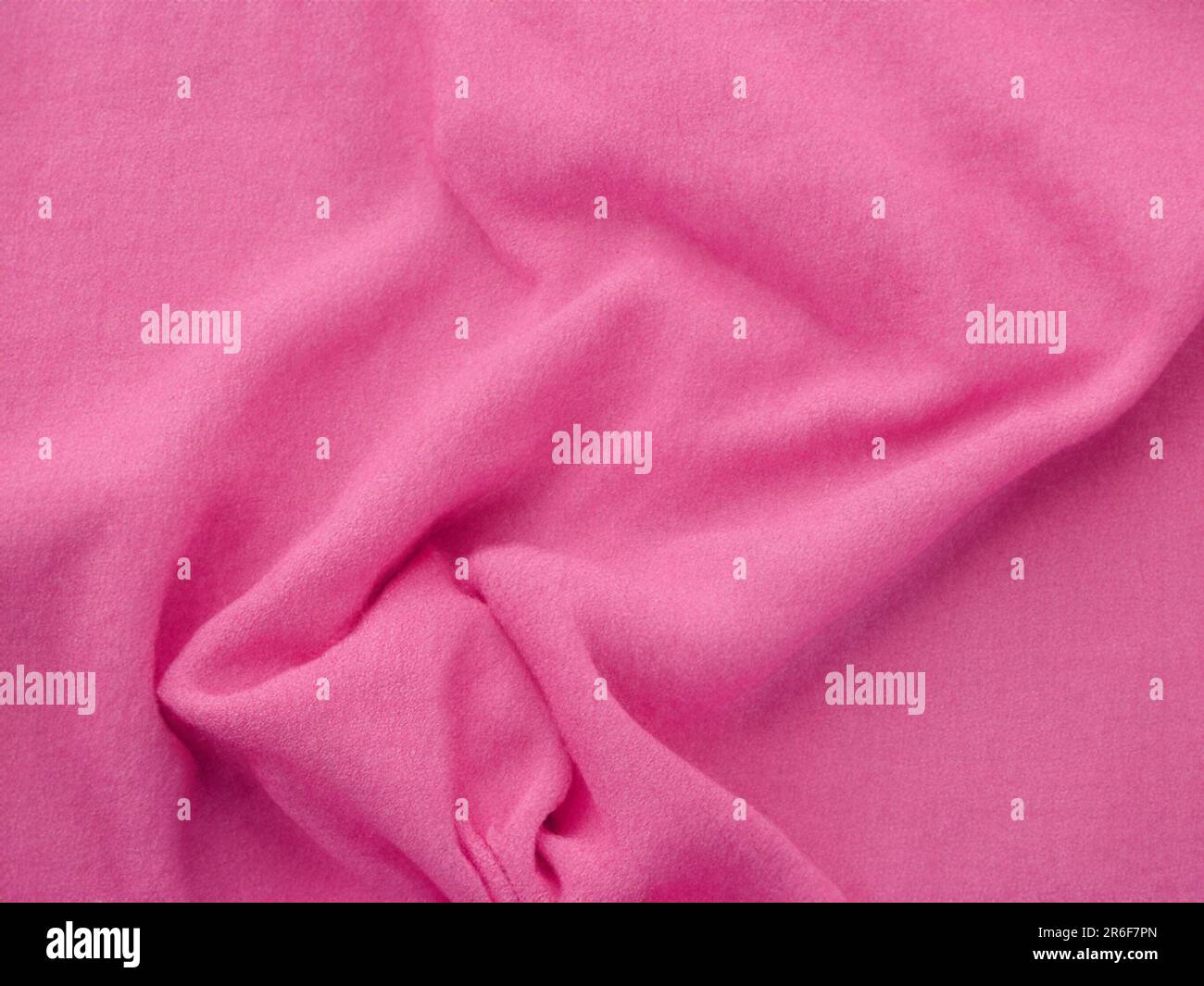 a close up of a pink fabric with a white background. . Stock Photo