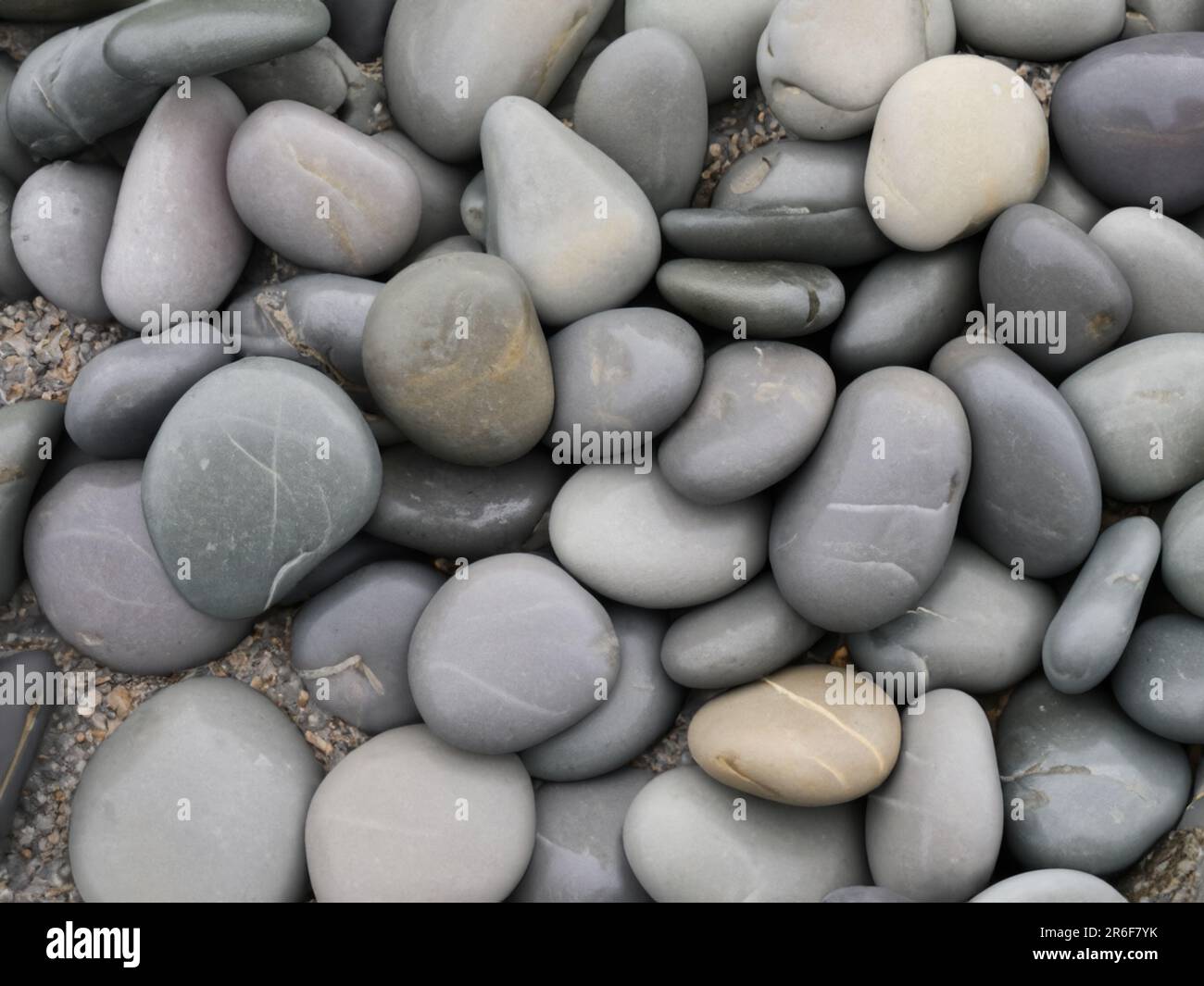a bunch of rocks that are laying on the ground together. . Stock Photo