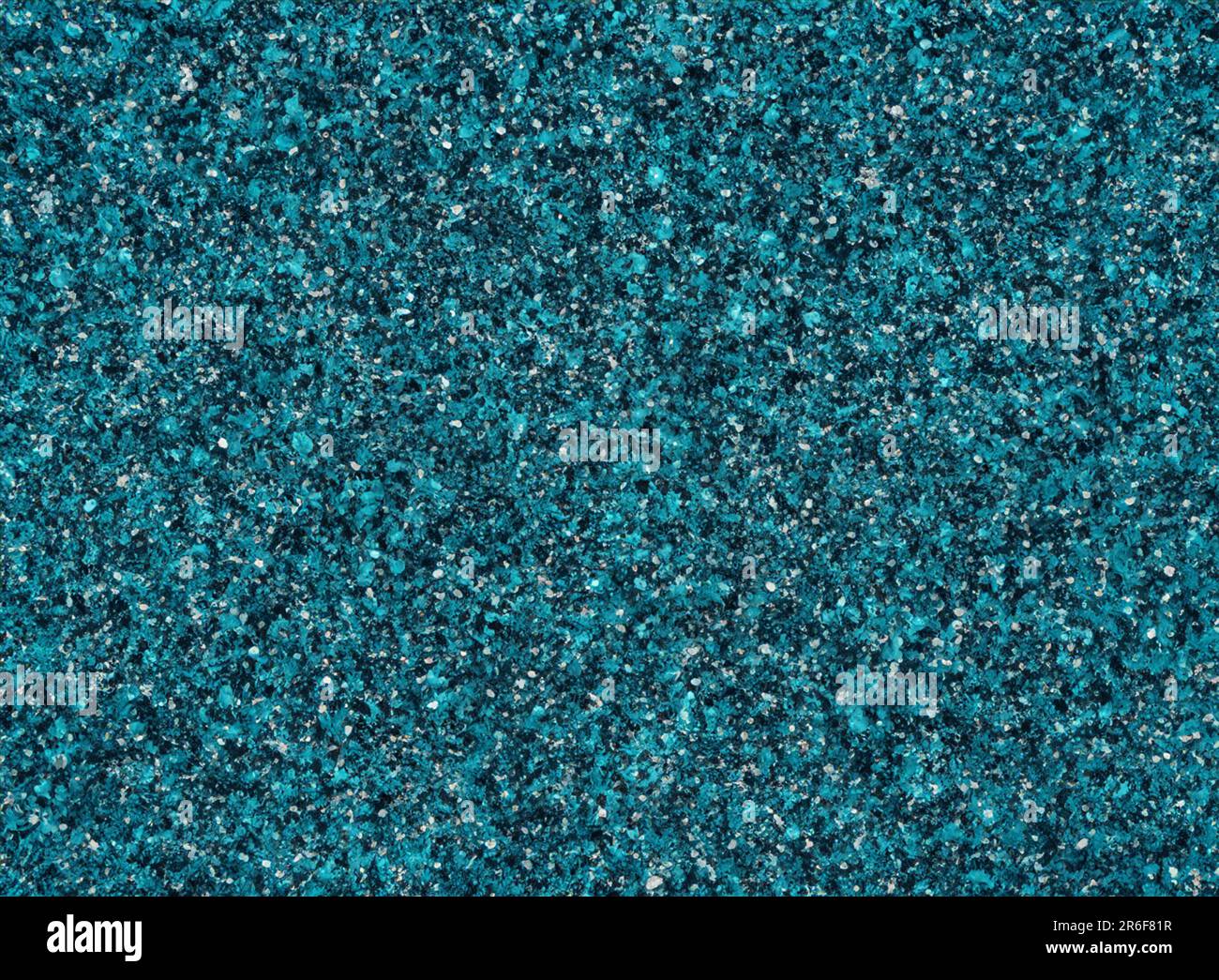 a close up of a teal colored carpet with small speckles. . Stock Photo