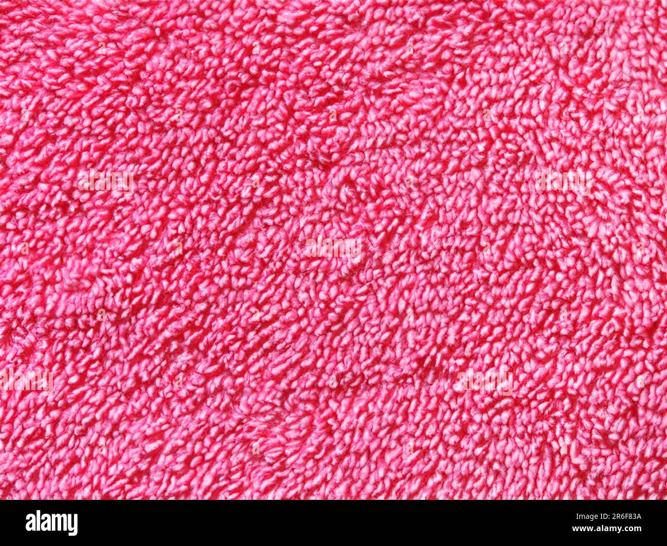 a close up of a pink towel with a white background. . Stock Photo