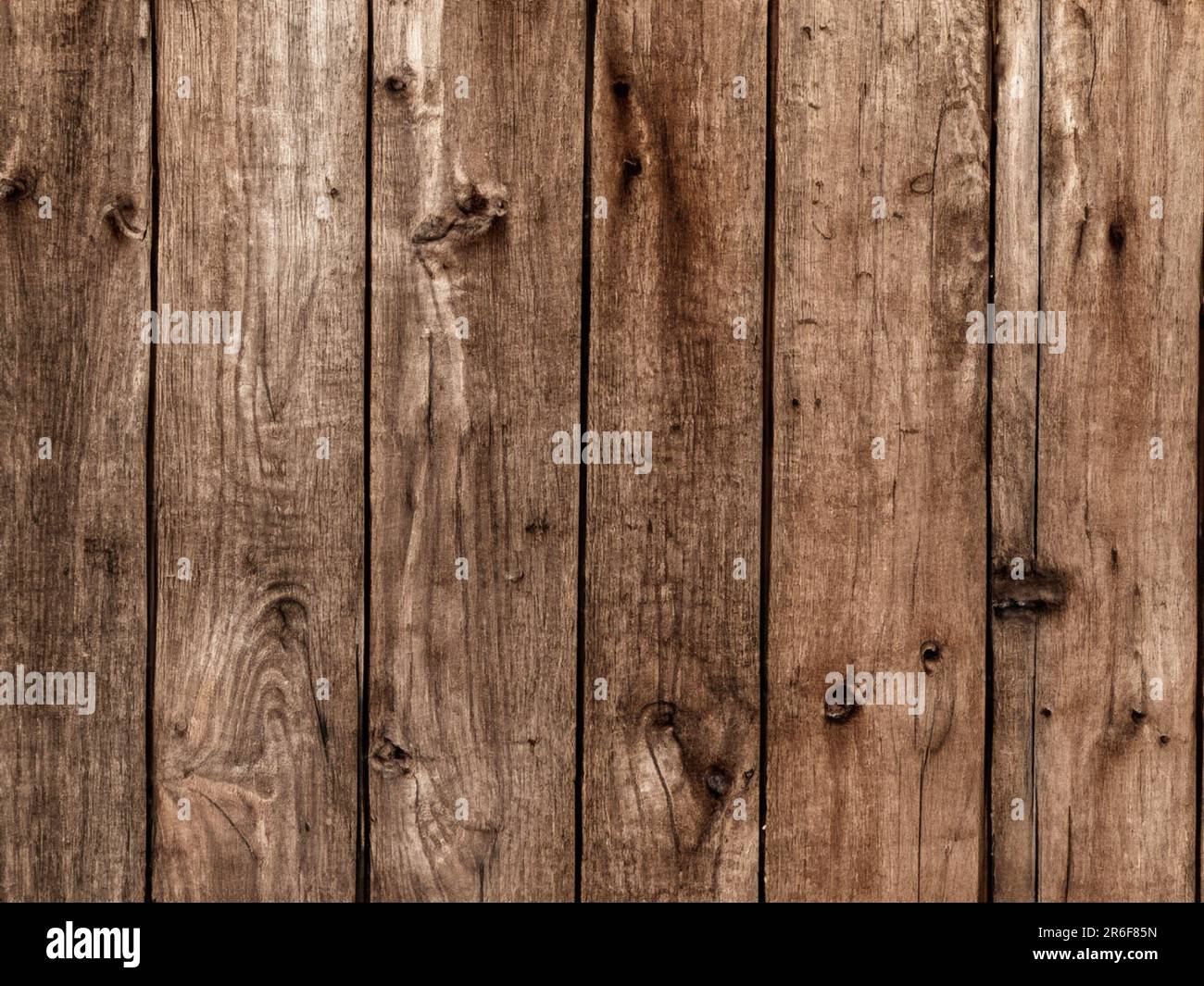 a close up of a wooden fence with nails on it. . Stock Photo