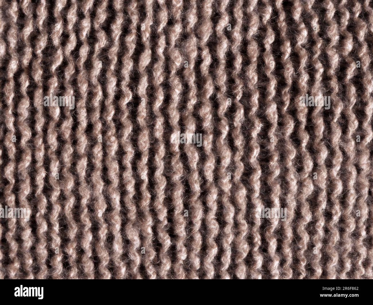a close up view of a brown carpet with a pattern. . Stock Photo