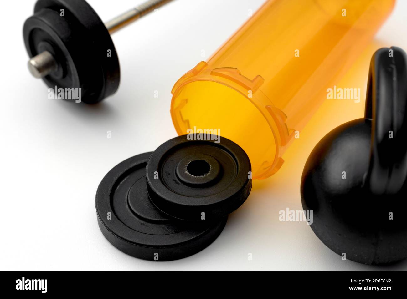 Strength Training Equipment and Prescription Pill Bottle Concept for Sort and Exercise Medicine, Therapeutic Exercise Benefits, Fitness as Medicine an Stock Photo